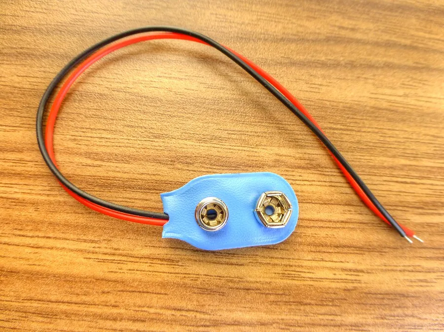 9V battery clip with red and black wires